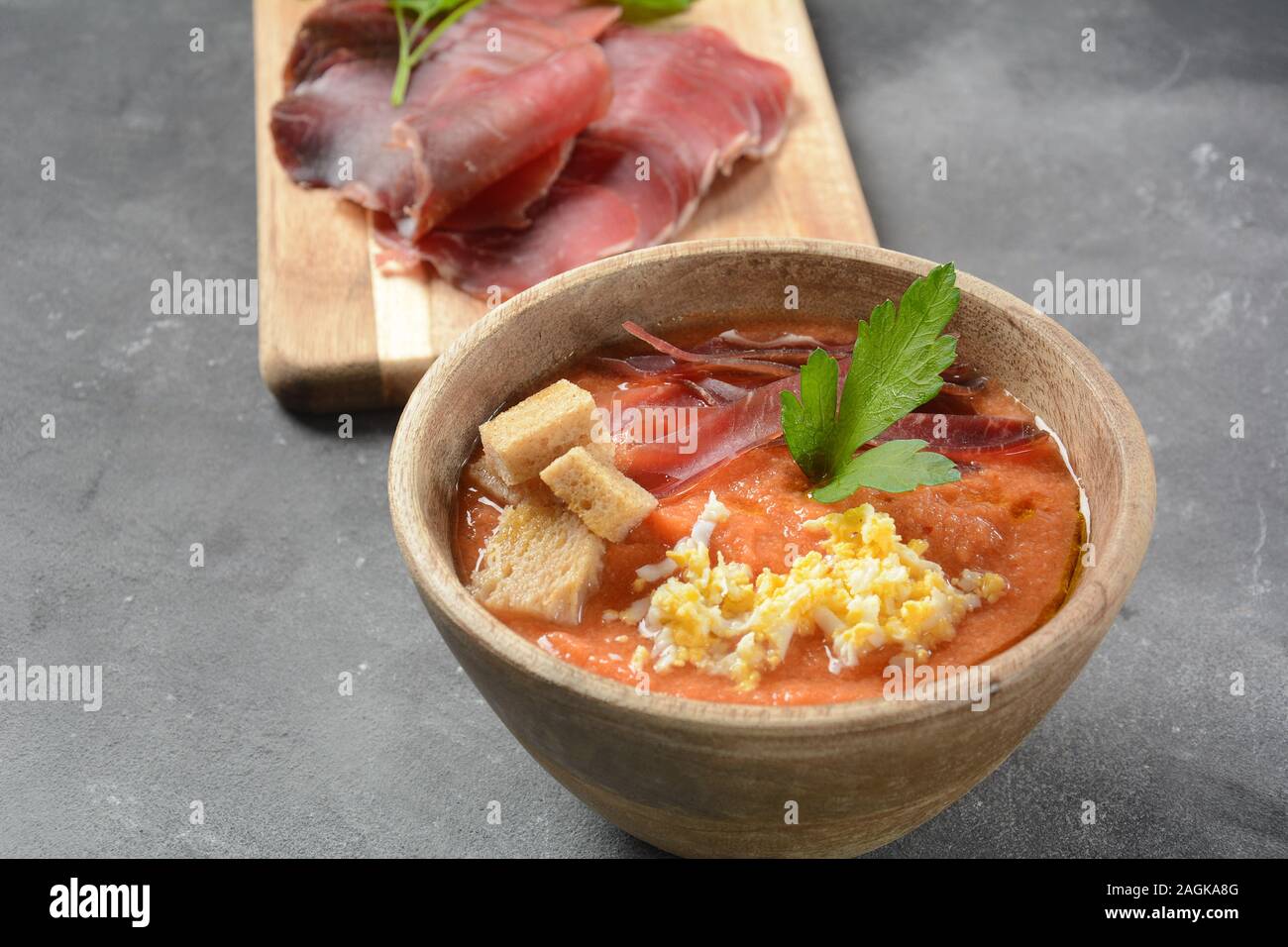 Traditional Spanish andalusian tomato cream soup Salmorejo served with