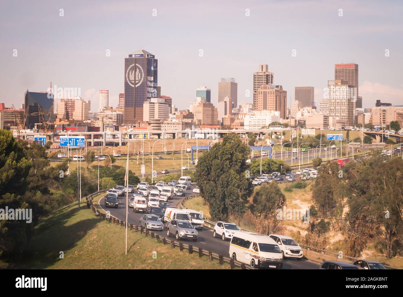 Johannesburg, South Africa - December 3,2019 - view of skysracpers in the city centre and the traffic on a motorway Stock Photo