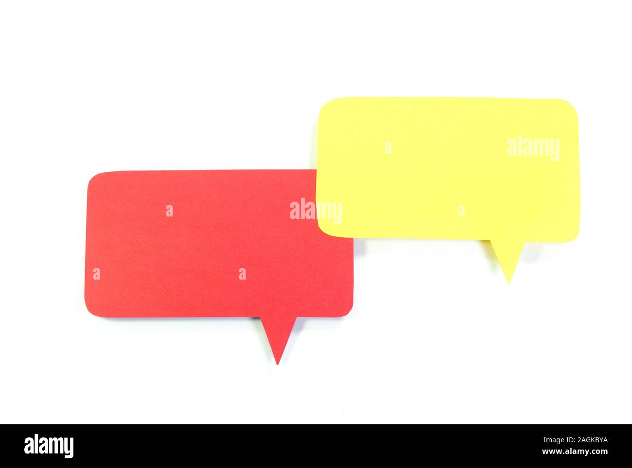 Red and yellow speech bubbles on white background Stock Photo