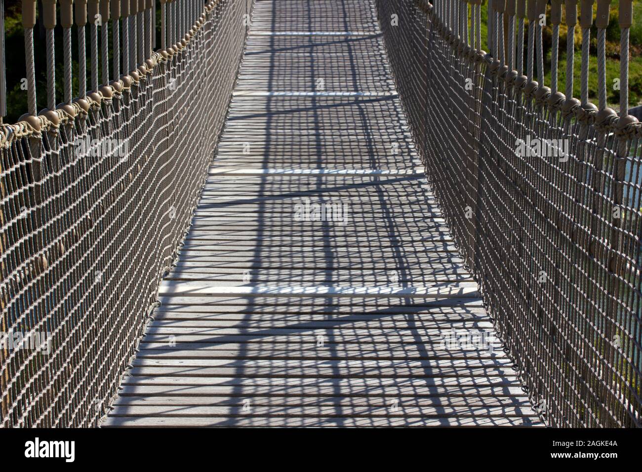 wooden suspension bridge in public park Stock Photo Alamy