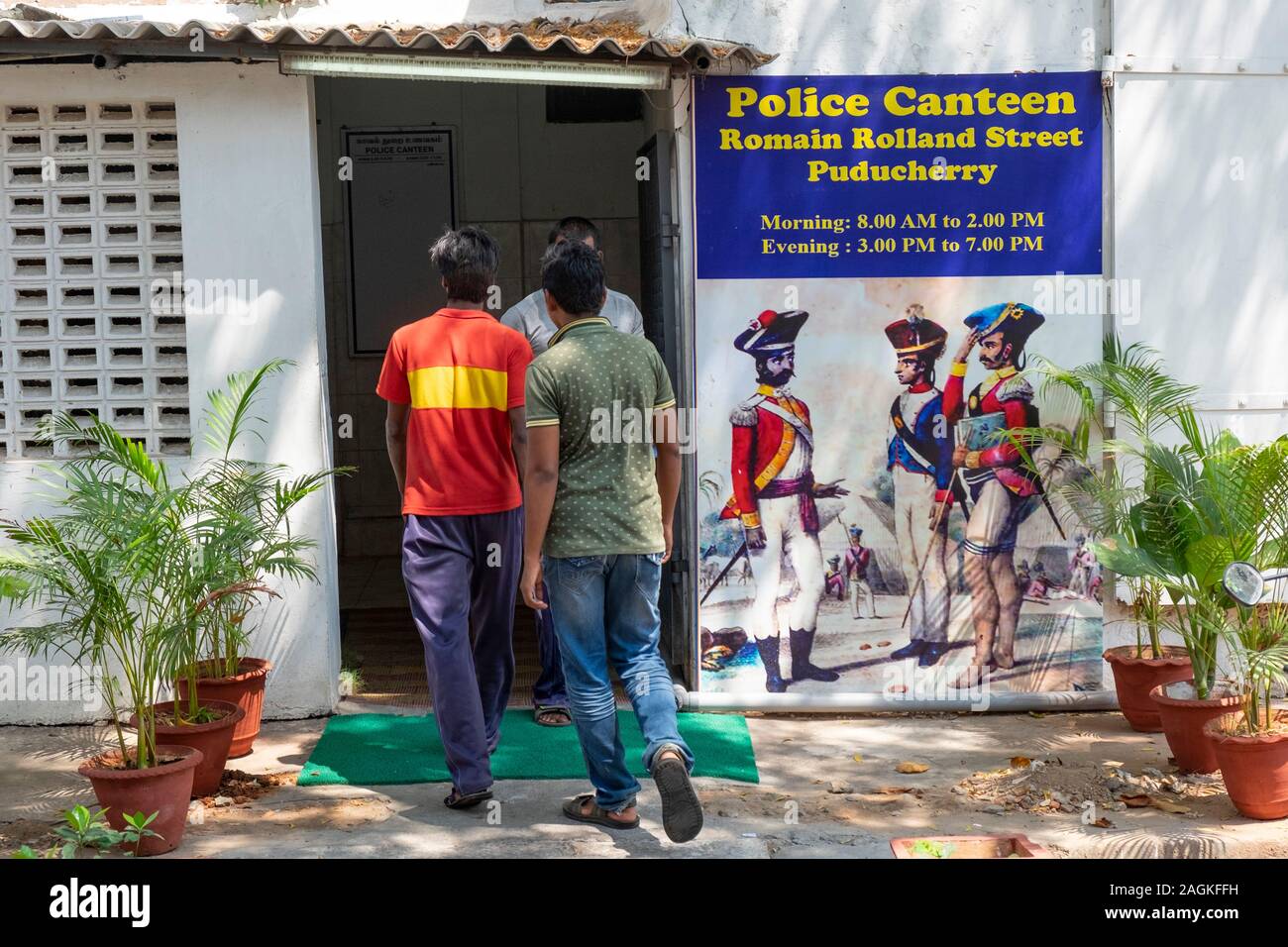 Men entering in the police canteen, Puducherry, Tamil Nadu, India Stock Photo