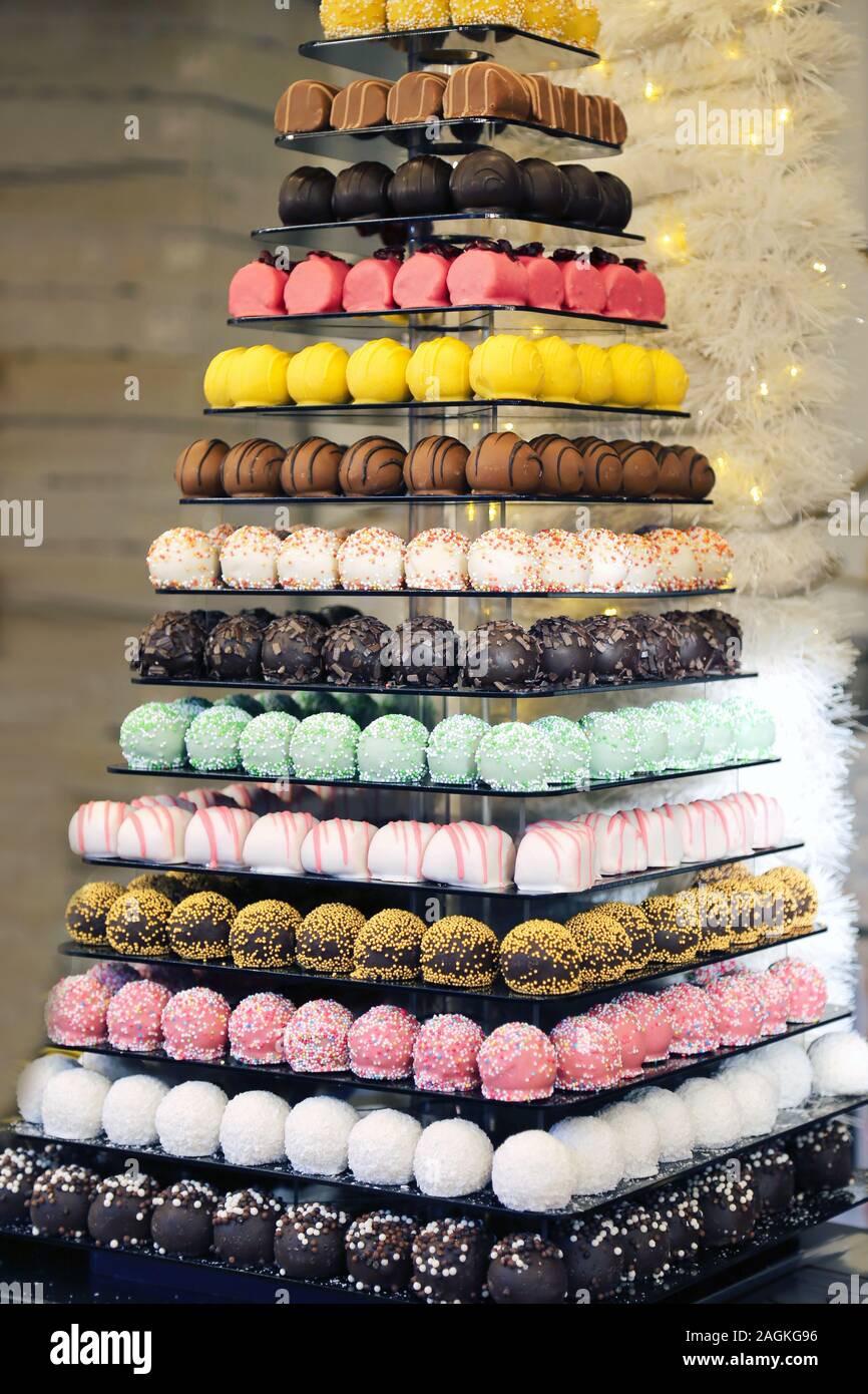 Tower or pyramid and cupcakes on sweet dessert table. Sweets in various  stylish bonbons for sale Stock Photo - Alamy