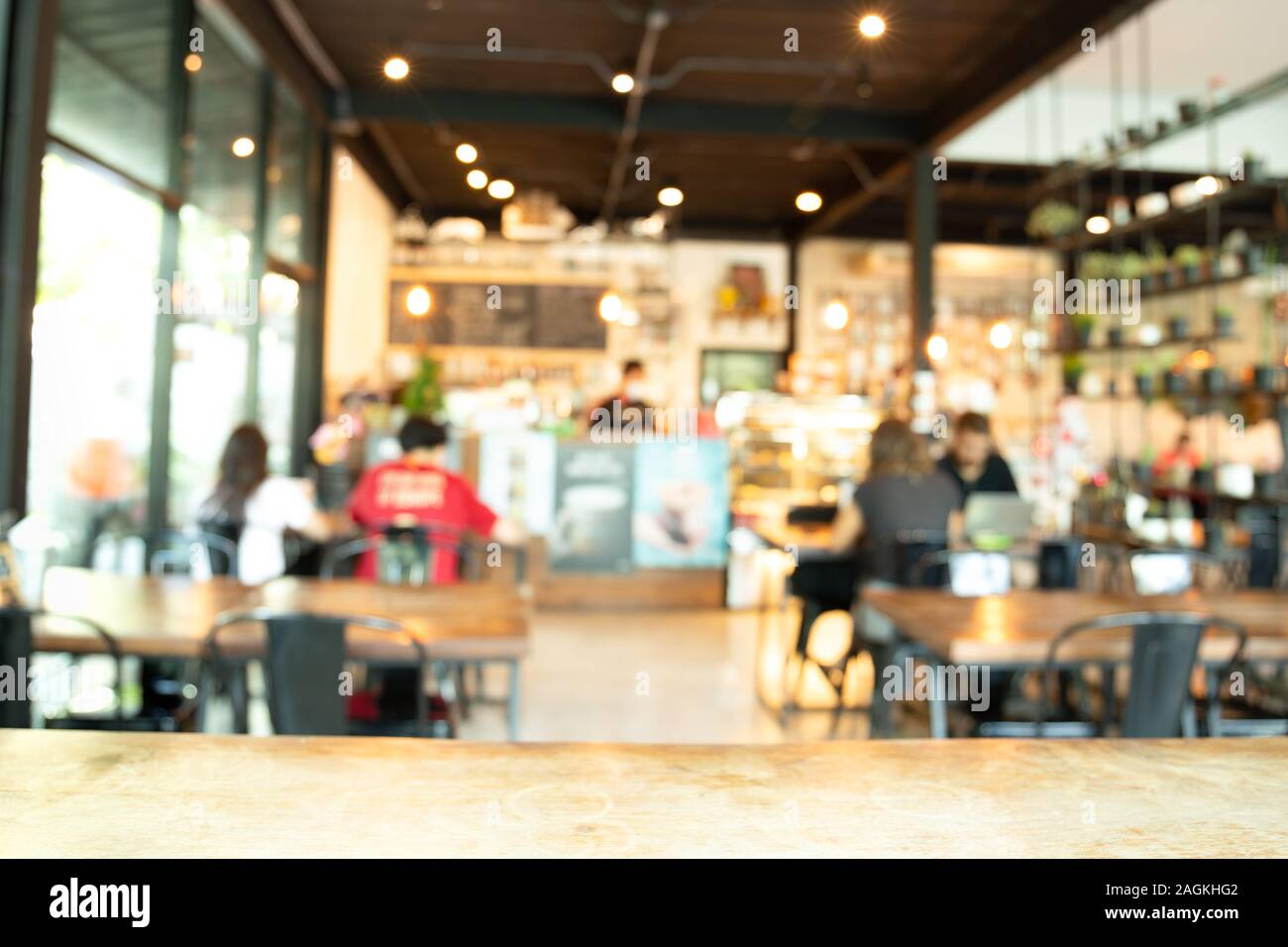 Blurred background barista service customers at counter in coffee shop business concept. Stock Photo