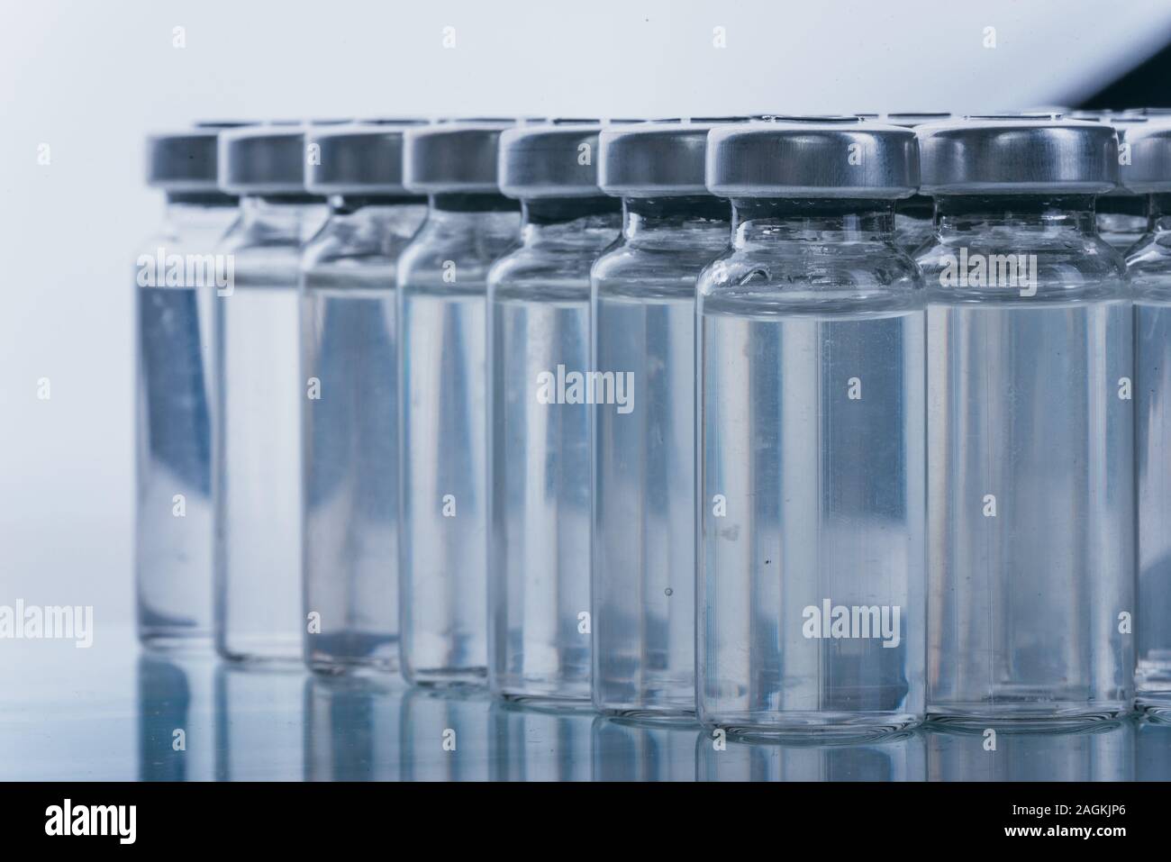 Glass medical ampoule vial for injection. Medicine is dry white drug ...