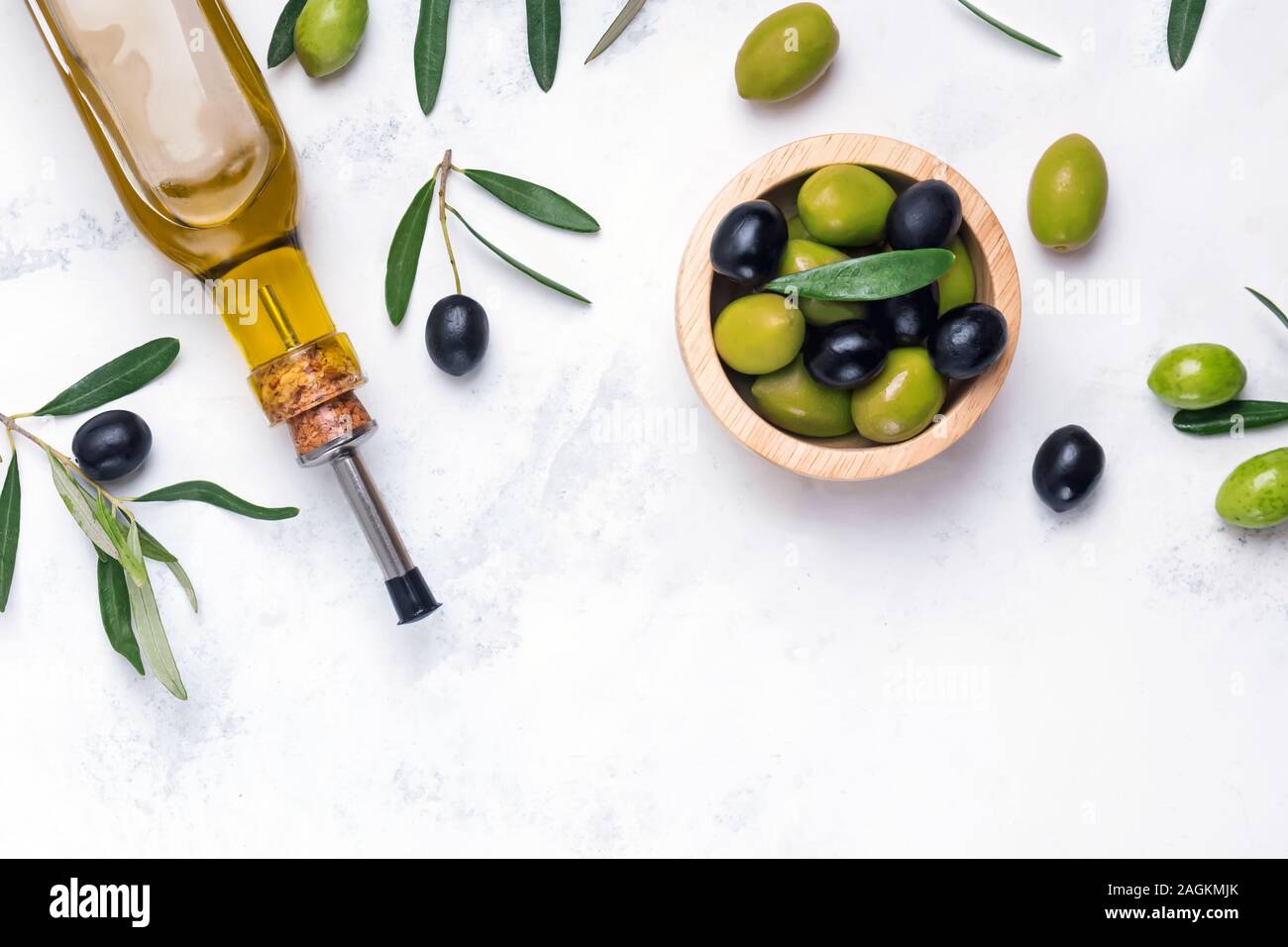 Extra virgin olive oli and green and black olives Stock Photo - Alamy