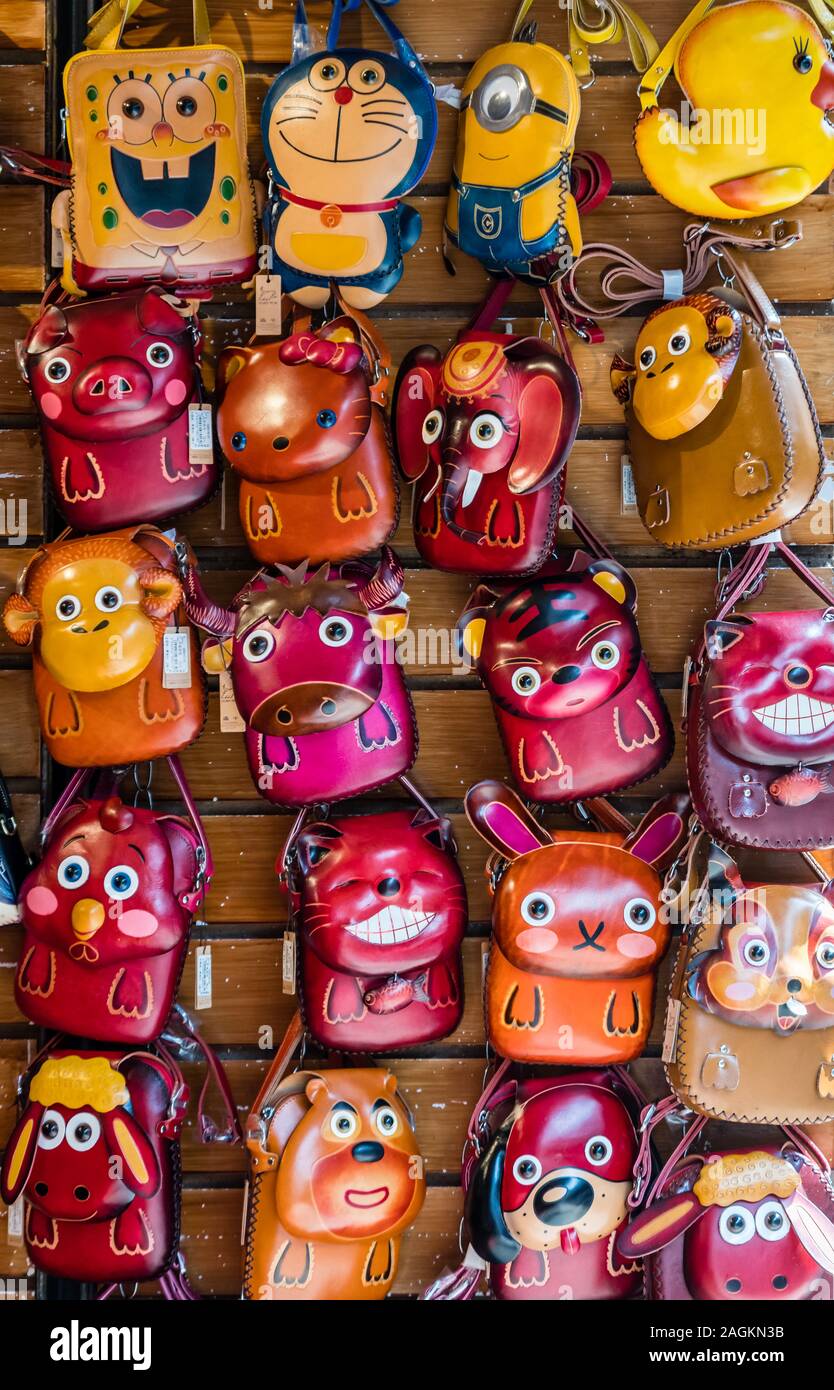 Yangshuo, China - August 2019 : Cute toy souvenirs for sale souvenir shops in the centre of Yangshuo old town, Guangxi Province Stock Photo