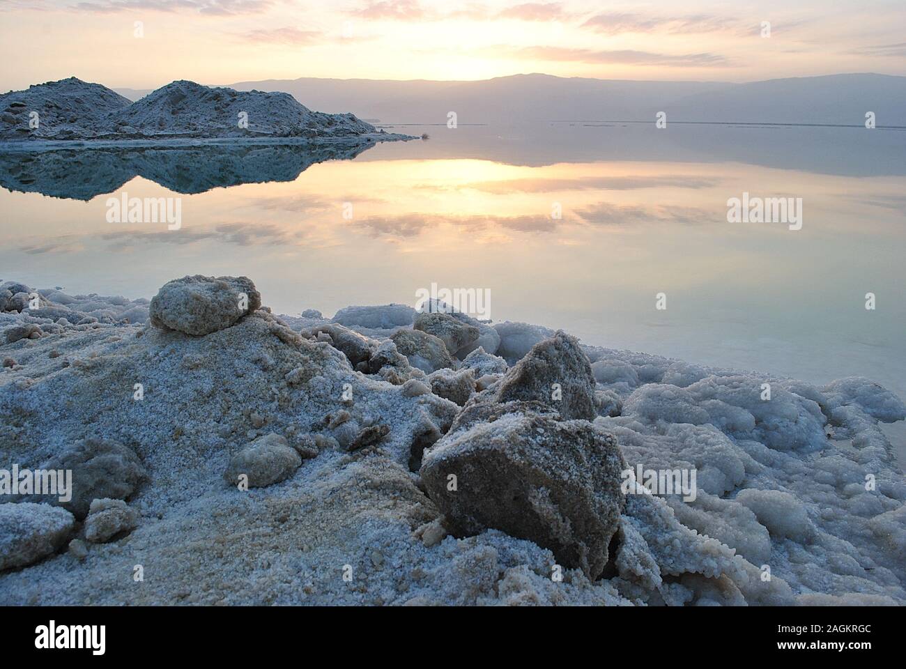 Sunrise over the Dead Sea shore in Israel. The lowest place on Earth. Salt crystals at sunrise Stock Photo