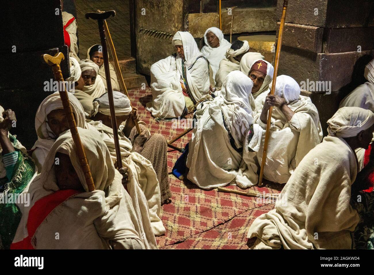 Ethiopia, Amhara Region, Lalibela, Yemrehanna Kristos monastery, festival of Archangel Gabriel, female pilgrims sat inside cave church Stock Photo