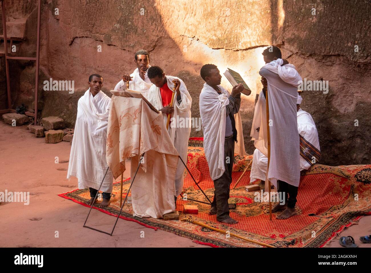 Ethiopia, Amhara Region, Lalibela, Bet Abba Libanos church, group of priests conducting open air mass in courtyard Stock Photo
