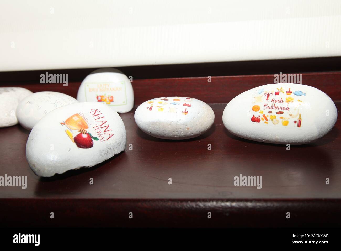Painted stones with Jewish messages painted on pebbles as part of the ...