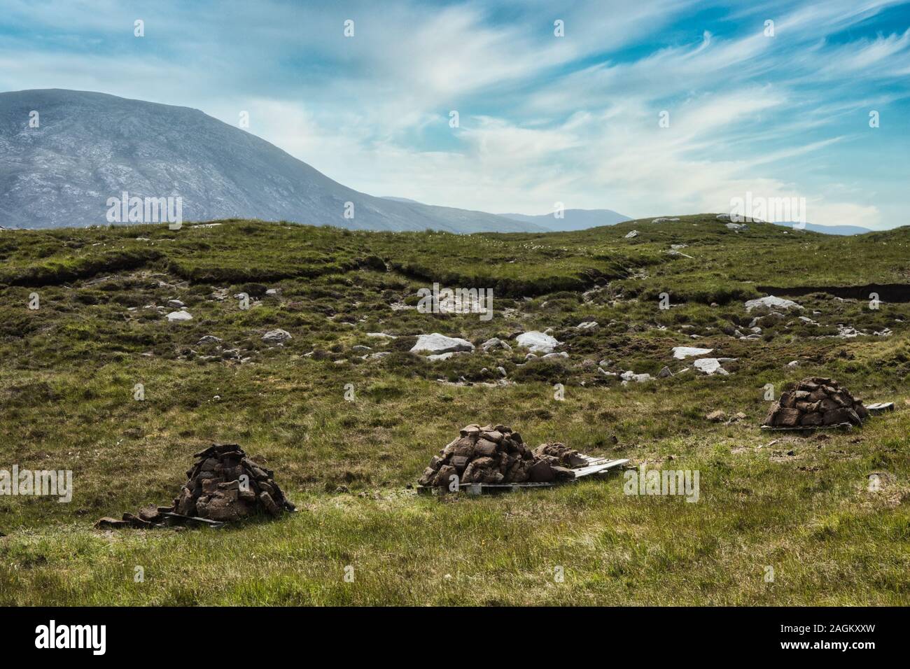 Peat drying next to the peat bank it was cut from, Isle of Harris, Outer Hebrides, Scotland Stock Photo