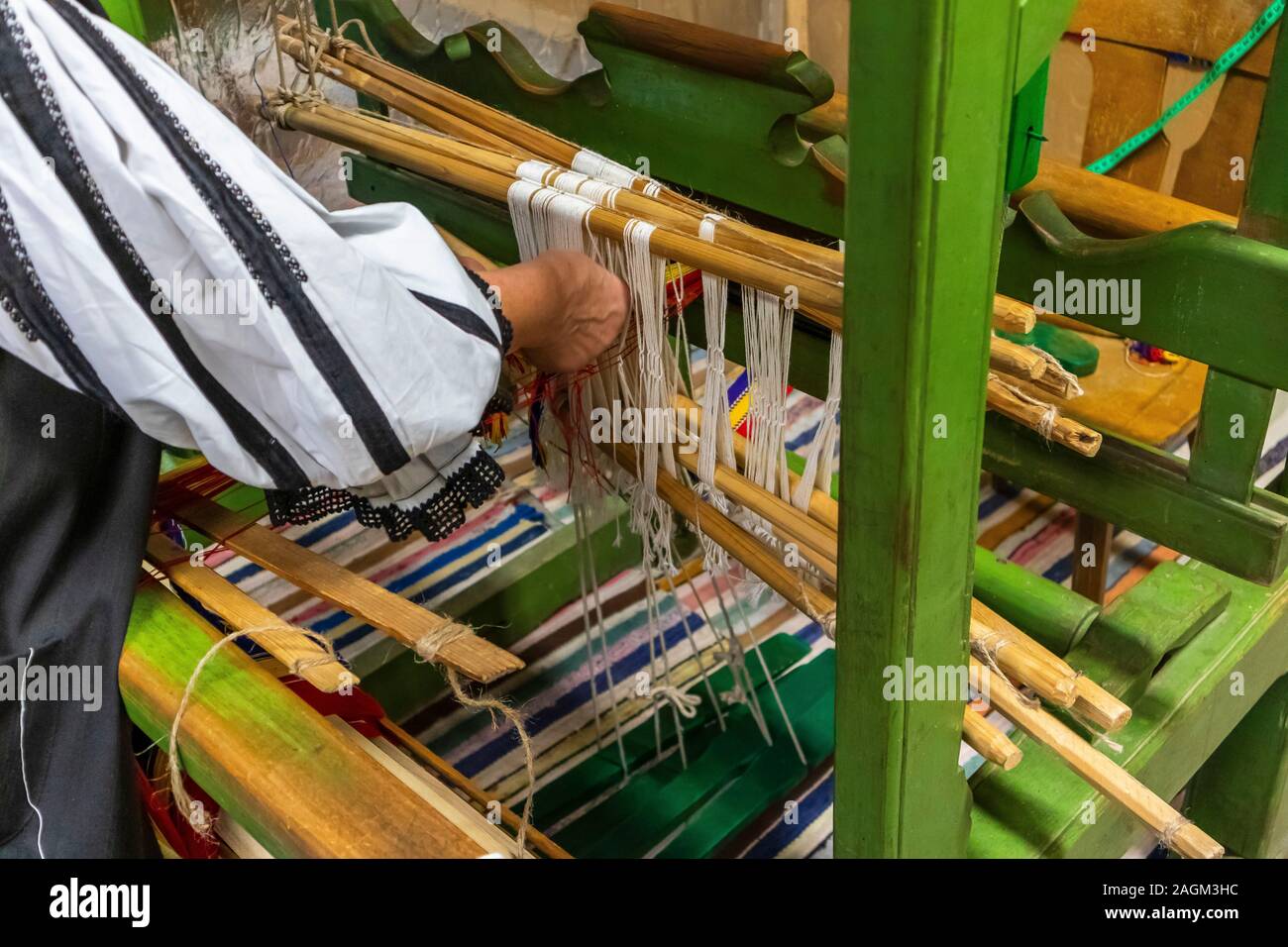 Woman working at hand weaving loom. Homemade Weaving Used for ...