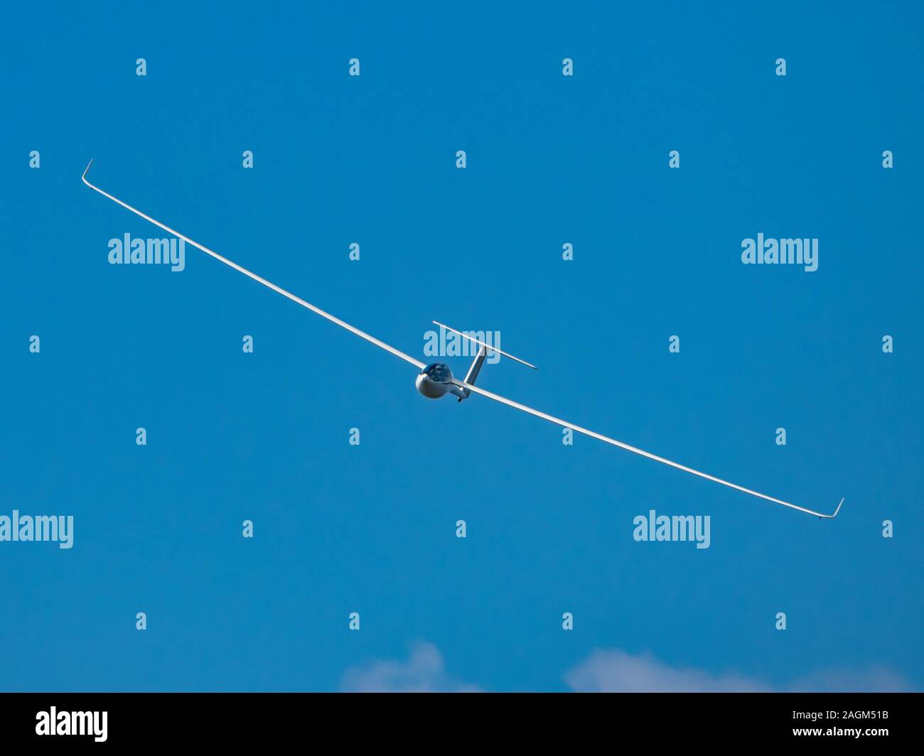 Glider plane flying in the clouds Stock Photo Alamy