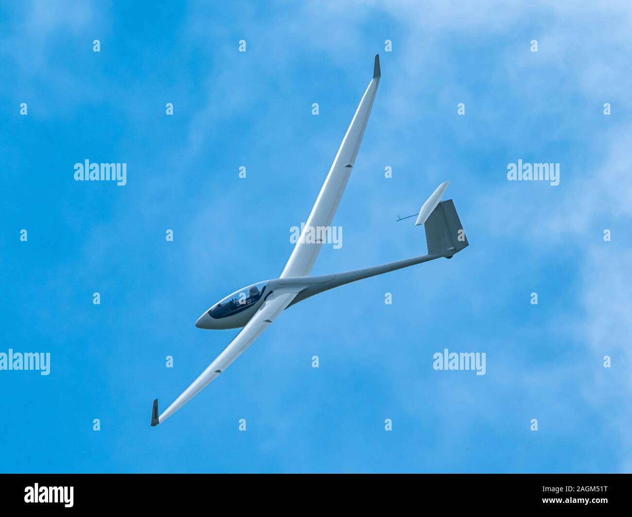 Glider plane flying in the clouds Stock Photo Alamy