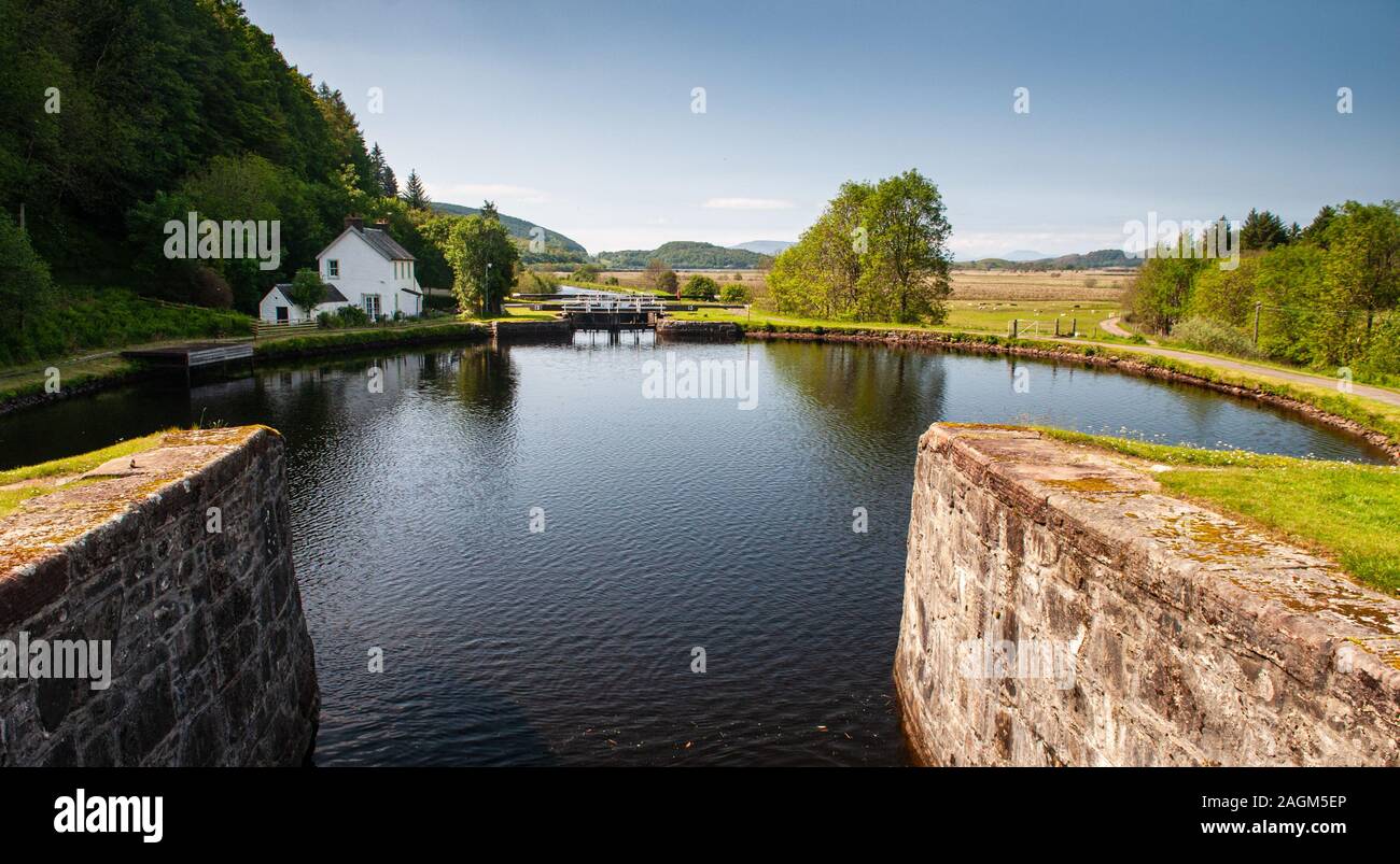 Crinan, Scotland, UK  - June 3, 2011: The Crinan Canal descends through lock gates at Dunardry in Argyll in the West Highlands of Scotland. Stock Photo