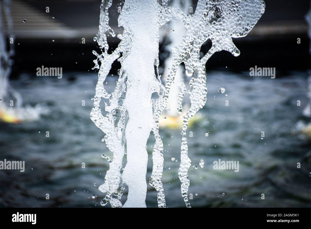 Water fountain close up spray of refreshing, cool, water droplet design in a fountain at a park