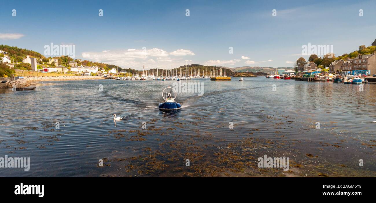 Argyll, Scotland, UK - June 3, 2011: Small hovercrafts arrive into the harbour at Tarbert on Loch Fyne in Argyll in the West Highlands of Scotland. Stock Photo