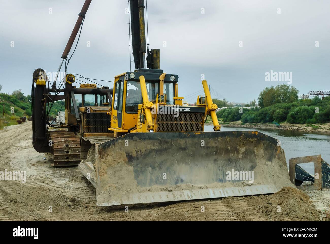Bulldozer on quay construction site. Tyumen Stock Photo