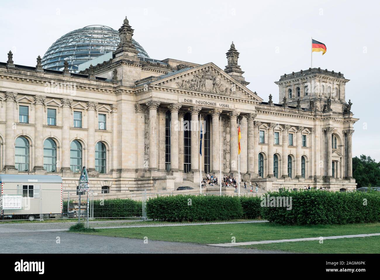 BERLIN, GERMANY - MAY 23, 2018: A view of the main facade of the Reichstag building in Berlin, Germany, with some visitors in the staircase, seen from Stock Photo