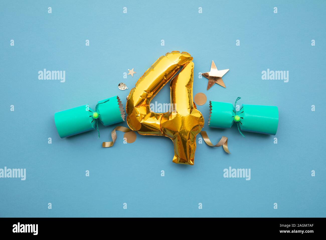 Christmas countdown. Gold number 4 with festive cristmas cracker decorations Stock Photo