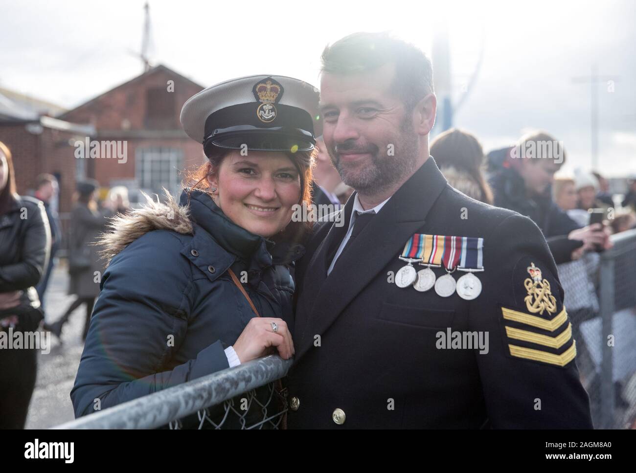 Petty Officer Michael Murphy with Monika Jakubikova after he disembarked from HMS Clyde following the ship's arrival back into Portsmouth for the first time in 12 years, ahead of her decommissioning ceremony. Stock Photo
