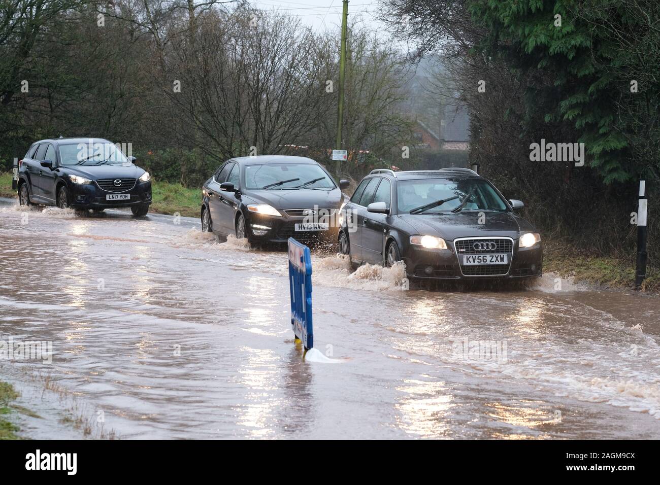 Maund Bryan, near Bodenham, Herefordshire, UK - Friday 20th December 2019 - Further heavy rain after a very wet winter has resulted in surface flooding on the main A417 road at Maund Bryan causing problems for drivers - Photo Steven May / Alamy Live News Stock Photo