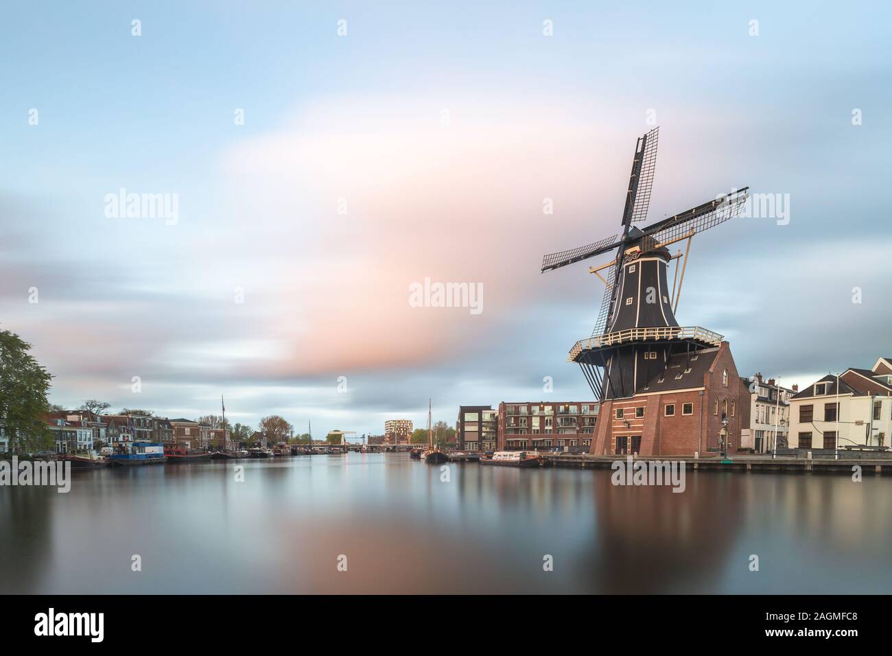 Windmill and Spaarne River, Haarlem, Netherlands Stock Photo