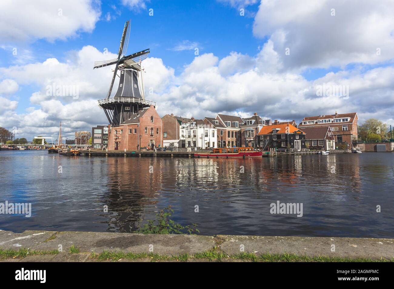 Windmill and Spaarne River, Haarlem, Netherlands Stock Photo