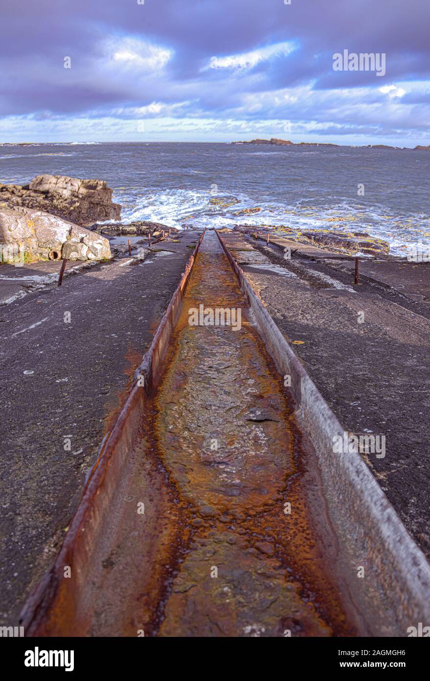 Rusty old lifeboat slipway at Ramore head, Portrush, County Antrim