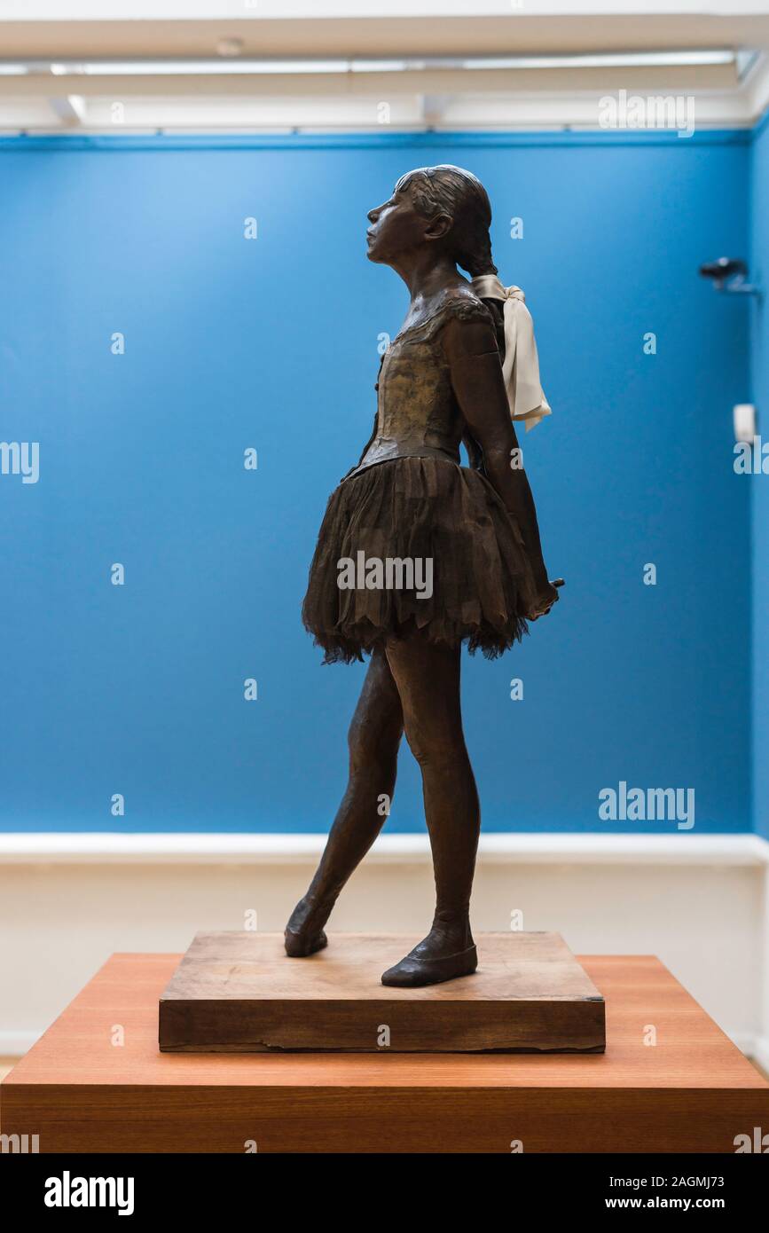 Degas dancer, side view of the bronze sculpture by Edgar Degas titled The Little 14 Year Old Dancer (1881) Ny Carlsberg Glyptotek museum, Copenhagen. Stock Photo