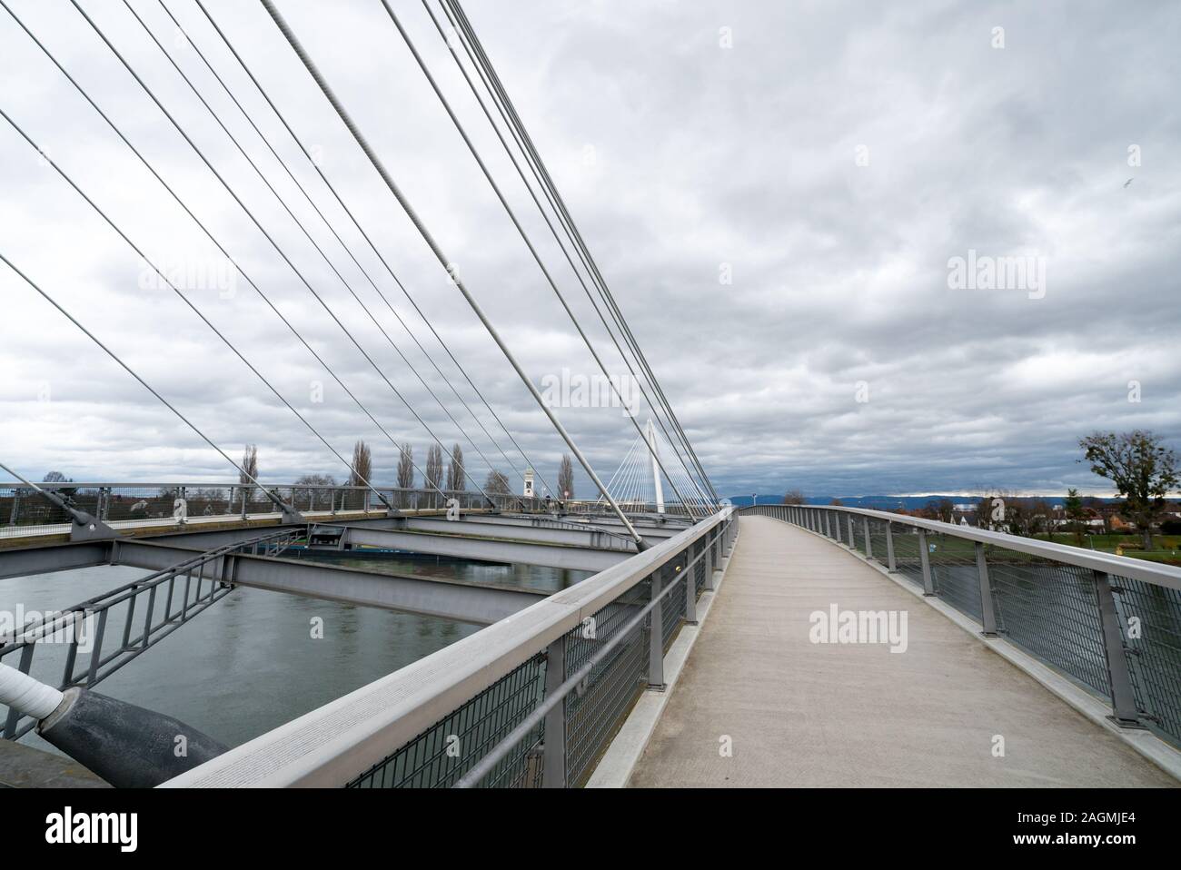 A view of the Passerelle des Deux Rives Bridge over the Rhine River outside of Strasbourg Stock Photo