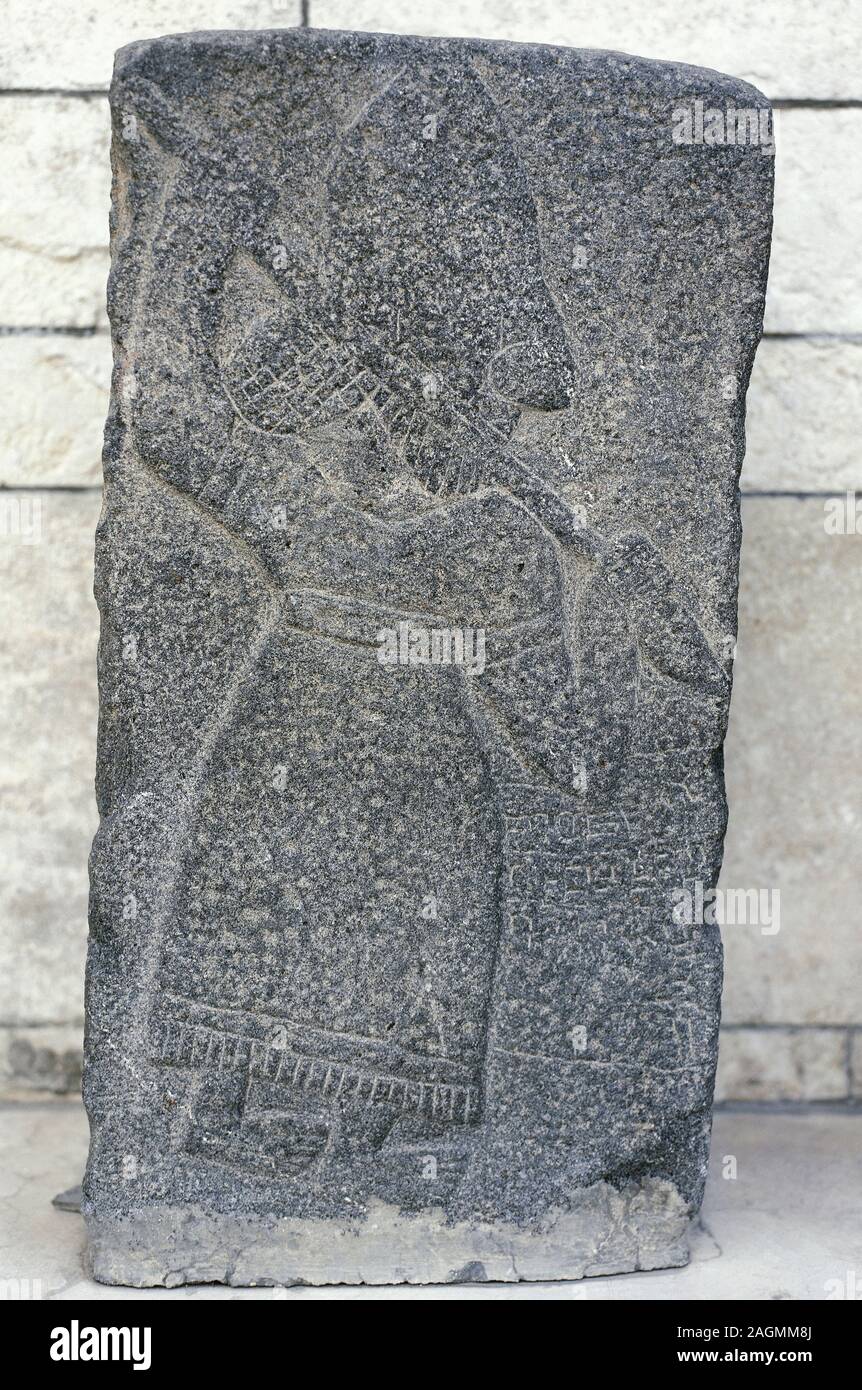 The Arameans were an ancient Northwest Semitic Aramaic-speaking tribal confederation who emerged from the region known as Aram (in present-day Syria), in the Late Bronze Age (11th to 8th centuries BC). Basalt relief. Warrior with spear. c. 8th century BC. National Museum of Aleppo. Syrian Arab Republic. Stock Photo