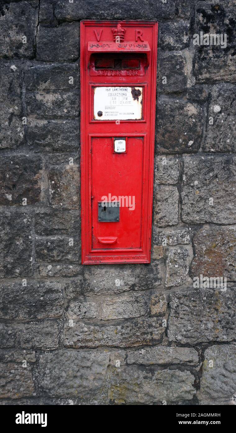 Victorian old Red Post-box Letterbox in a stone wall VR Stock Photo