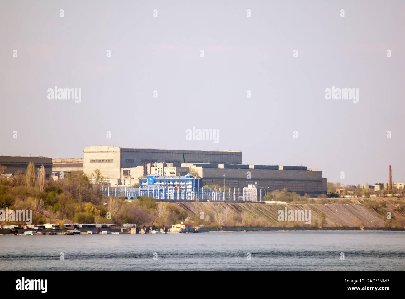 Ironworks located on the river coastline. Industrial landscape. Stock Photo