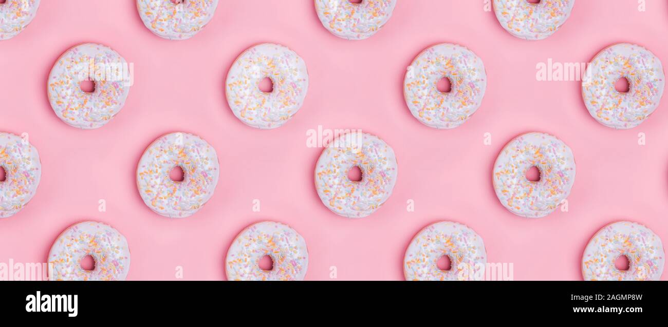 Creative background with delicious glazed donuts Stock Photo - Alamy