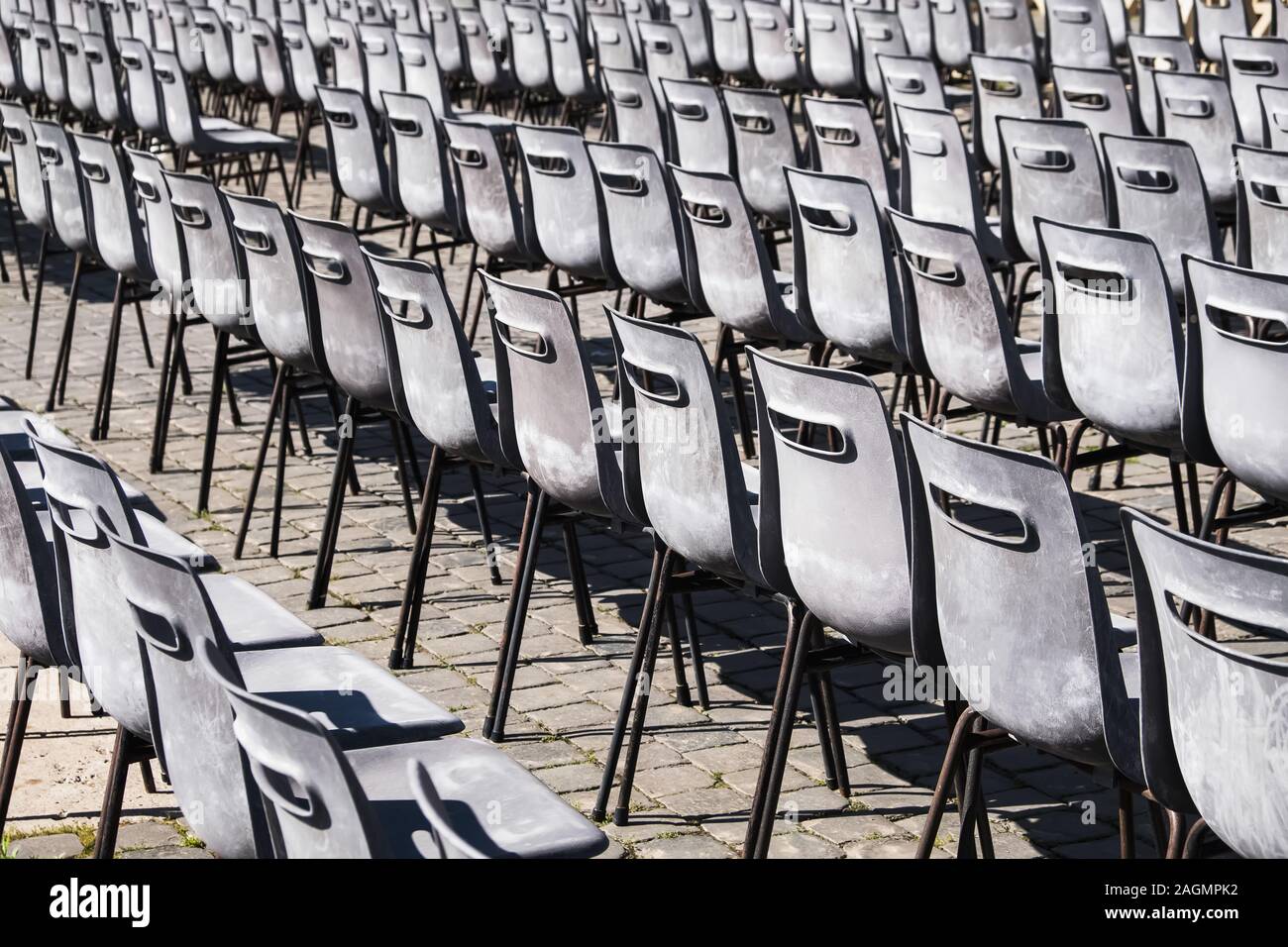 Rows of grey empty chairs Stock Photo