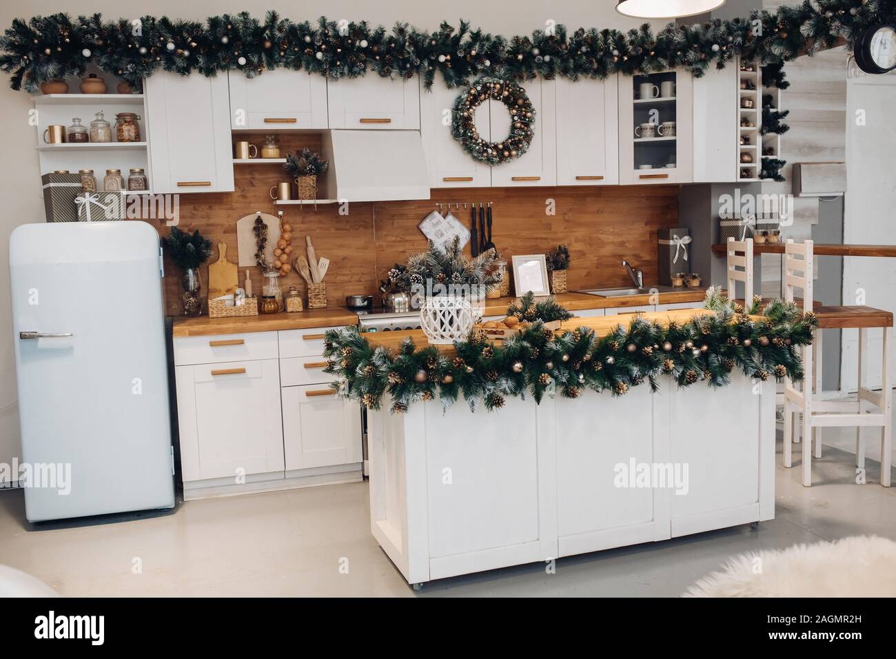 Beautiful white kitchen decorated for Christmas. Christmas holidays Stock Photo