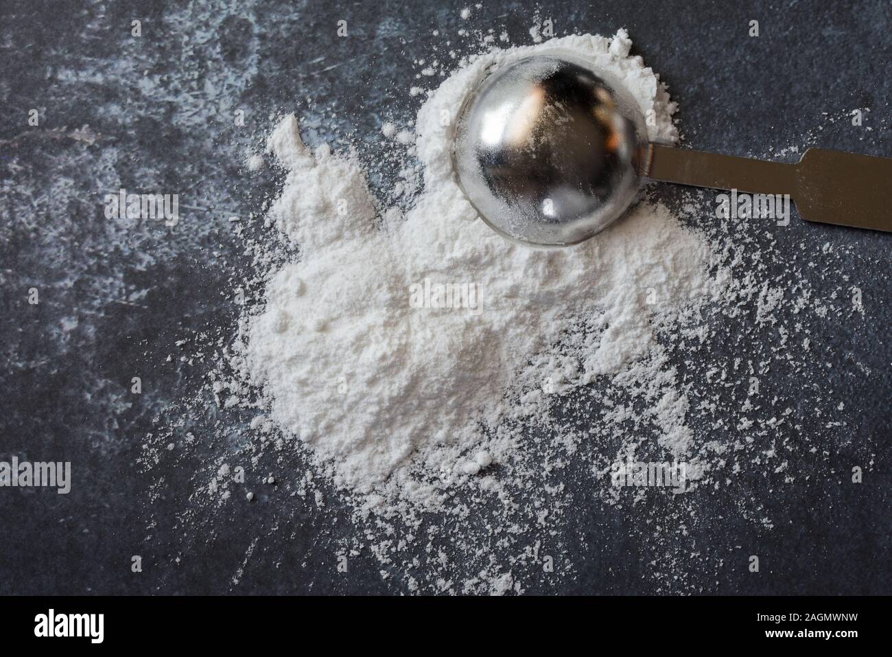 Baking Powder Spilled from a Teaspoon Stock Photo Alamy