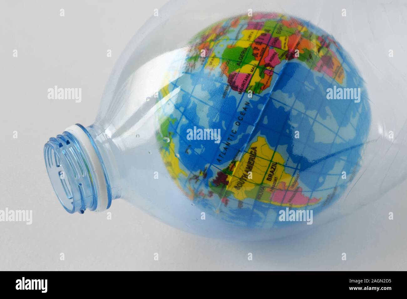 Earth globe in plastic bottle - Concept of plastic pollution and ecology Stock Photo