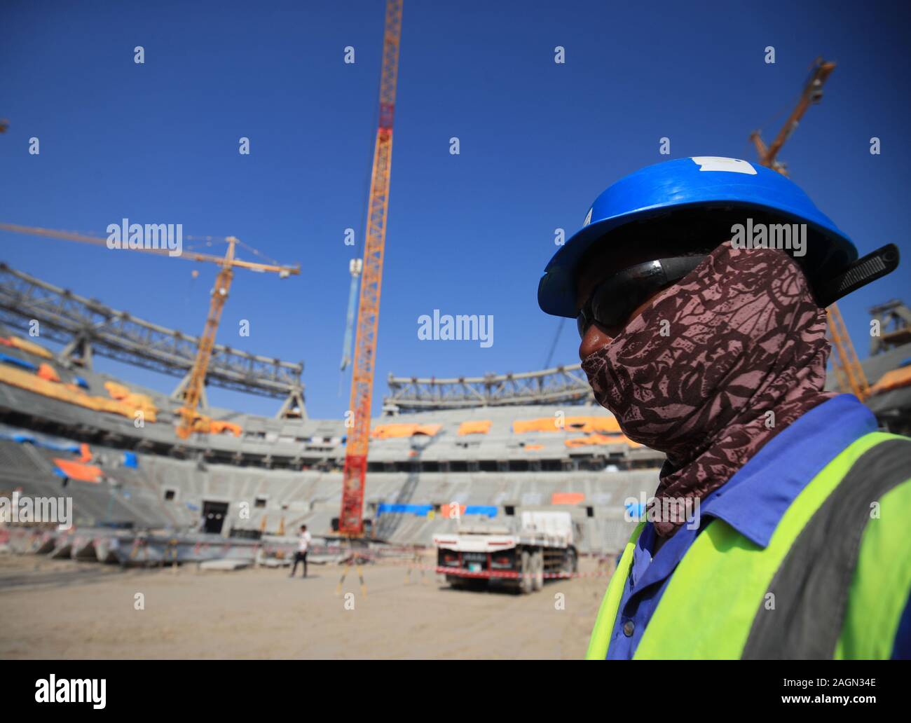 A construction worker at the Lusail Stadium in Lusail, Qatar. Stock Photo