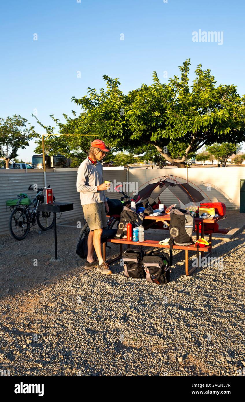 NEW MEXICO - Early morning at Lordsburg KOA Campground, packing and organizing gear while waiting for transport to the southern end of GDMBR. Stock Photo