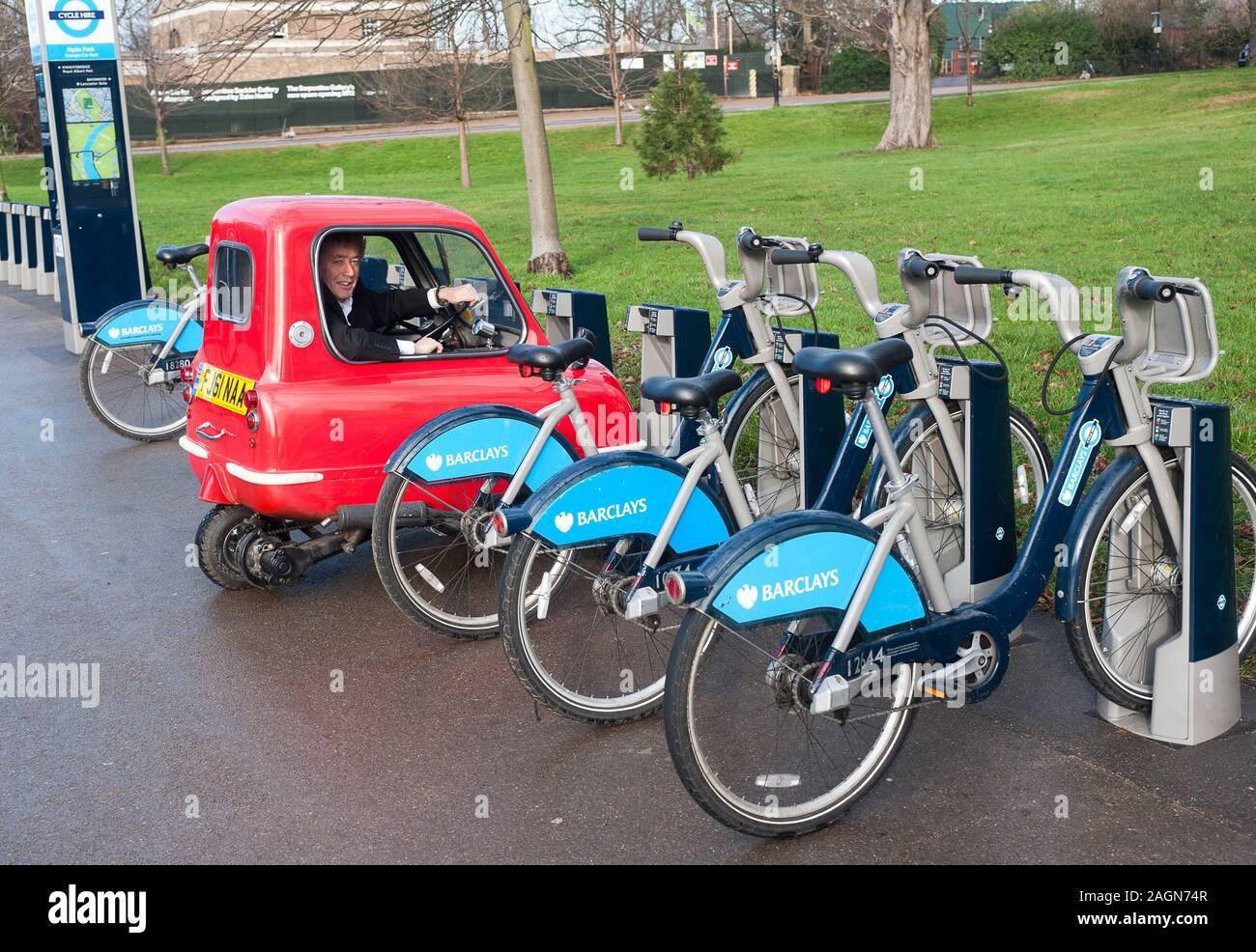 A Peel P50 the smallest car in the world is road tested around the streets and offices of Kensington. Stock Photo