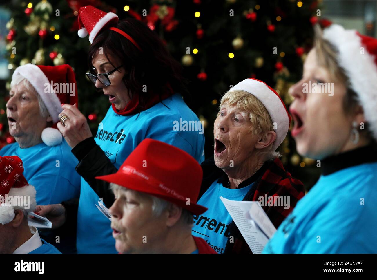 Alice McGregor (second right), a member of Memory Lane Choir, a choir for older people that welcomes members living with dementia, during their Christmas carols recital at Busaras in Dublin. Stock Photo