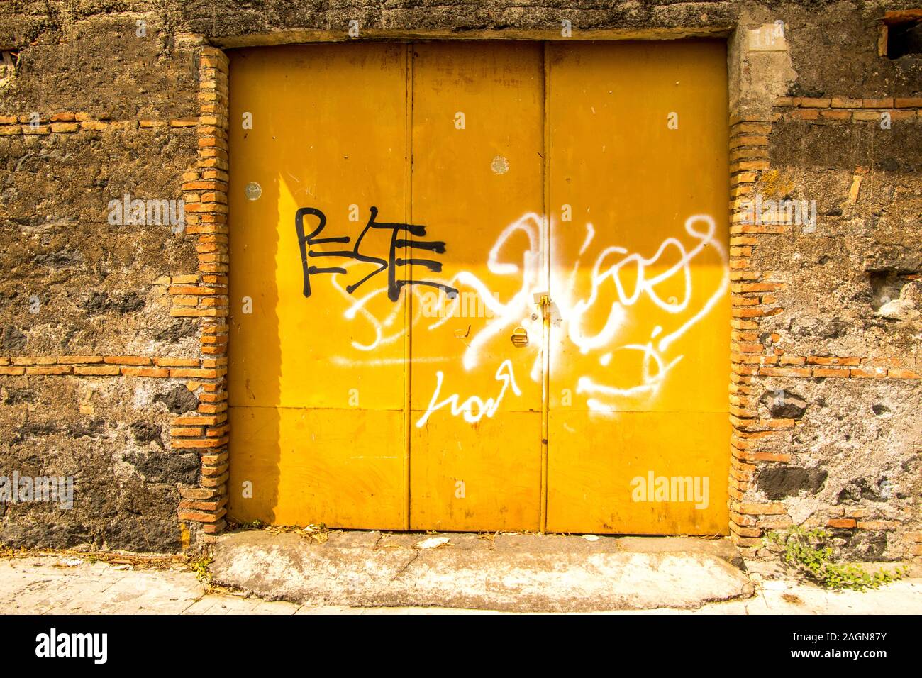 A set of double garage doors, closed and locked Stock Photo Alamy