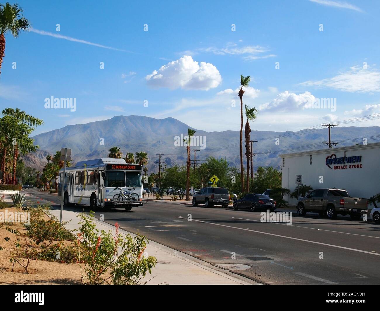 LA QUINTA, CA - JULY 17, 2018: A SunBus vehicle traveling through the La Quinta area of Palm Springs, California with a passenger bicycle riding in th Stock Photo