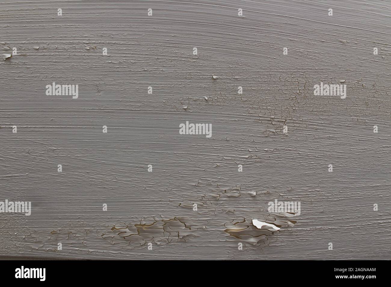 Wall with cracked white paint peeling off Stock Photo
