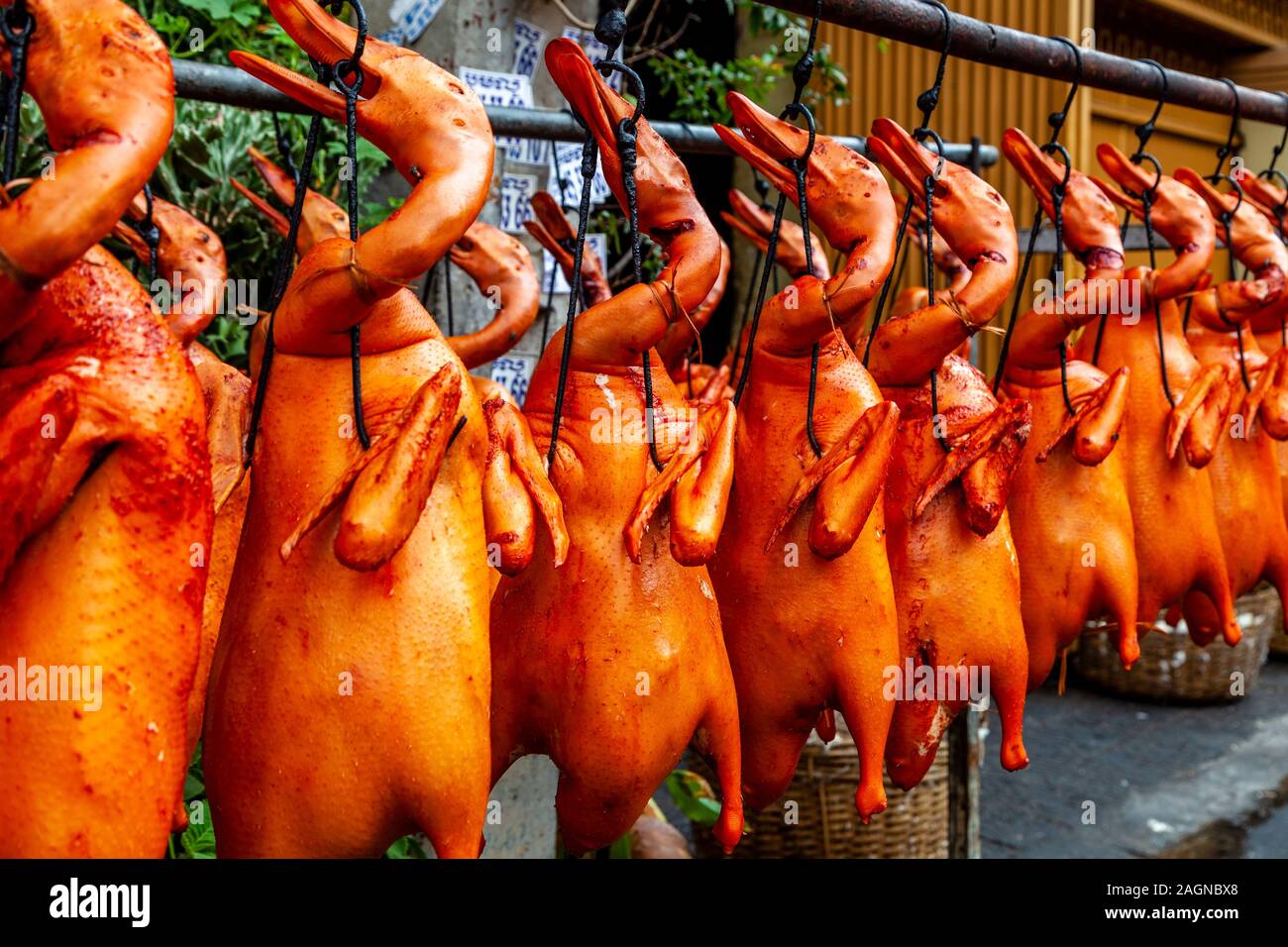 Cooked Ducks Hanging From A Rack In The Street, Phnom Penh, Cambodia. Stock Photo