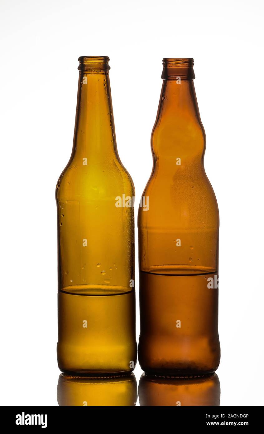 Empty glass bottles that can be used for different drinks. Stock Photo