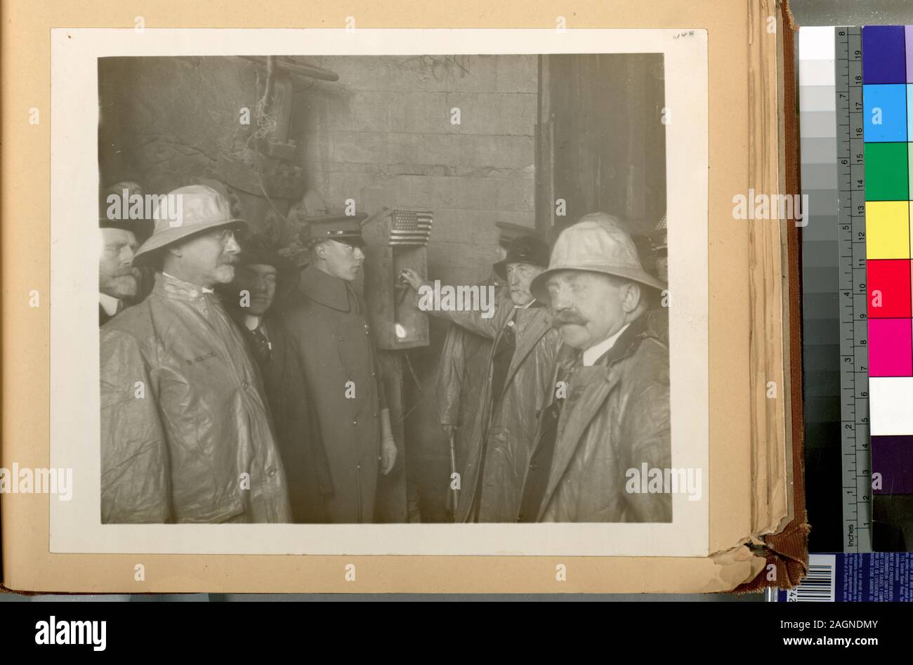 A collection of separate photographs accompanied by a typewritten, classified list of titles. Acc. Hdq. N. 1698; Organization. Hudson pressure tunnel. Mayor William J. Gaynor firing blast to connect East and West headings. In group, left to right, are Consulting Engineer John R. Freeman, Commissioner Charles Strauss, Chief Engineer J. Waldo Smith, Mayor Willian J. Gaynor and Commissioner John F. Galvin. Contract 90. January 30, 1912. Stock Photo