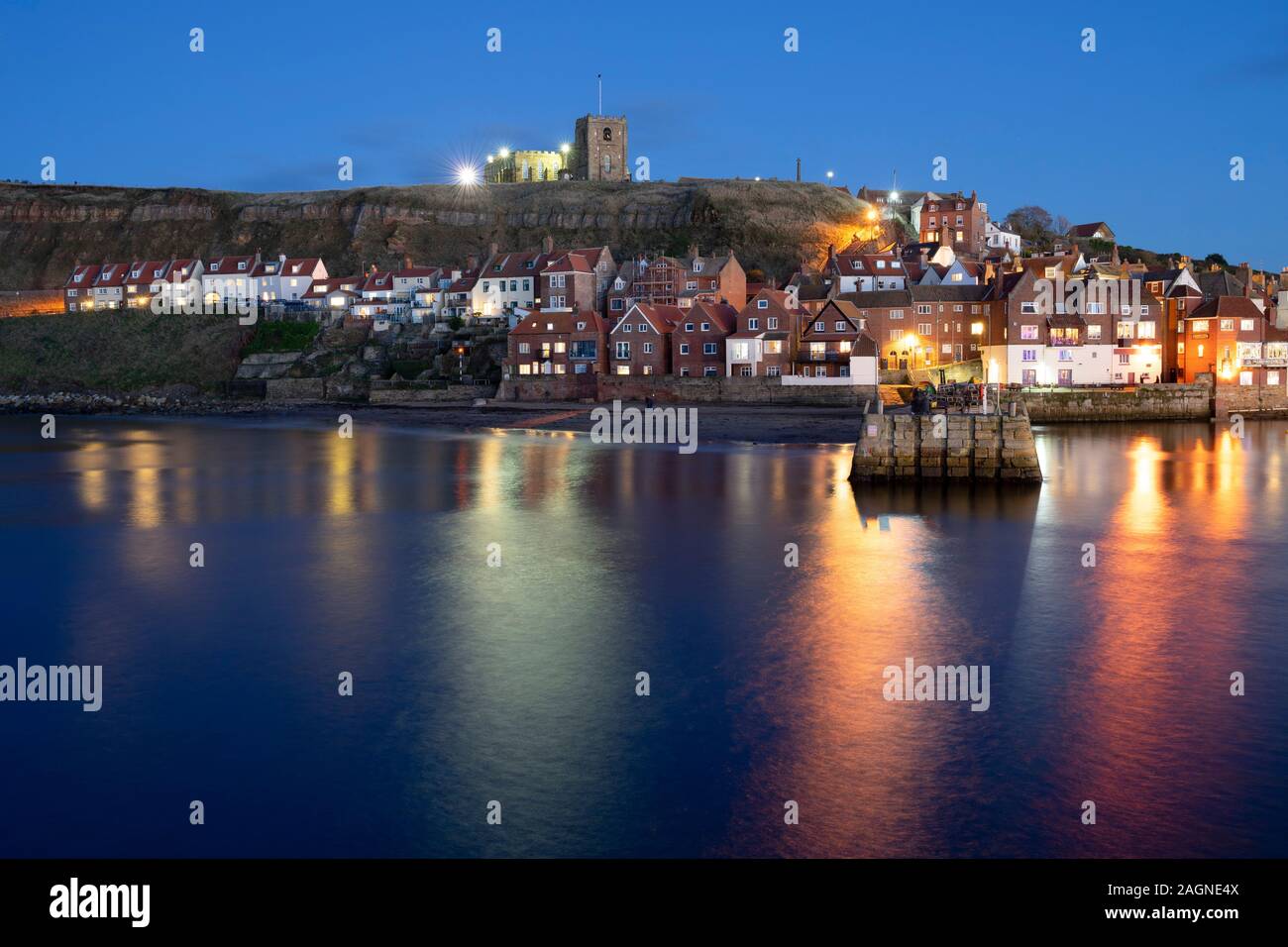 Night time at Whitby Harbour, Yorkshire Coast, UK Stock Photo